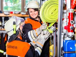 Volunteer fire brigade, not just a man's job. Women in honorary positions