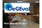 Event room, above it the logo of DeGEval and the event date.
